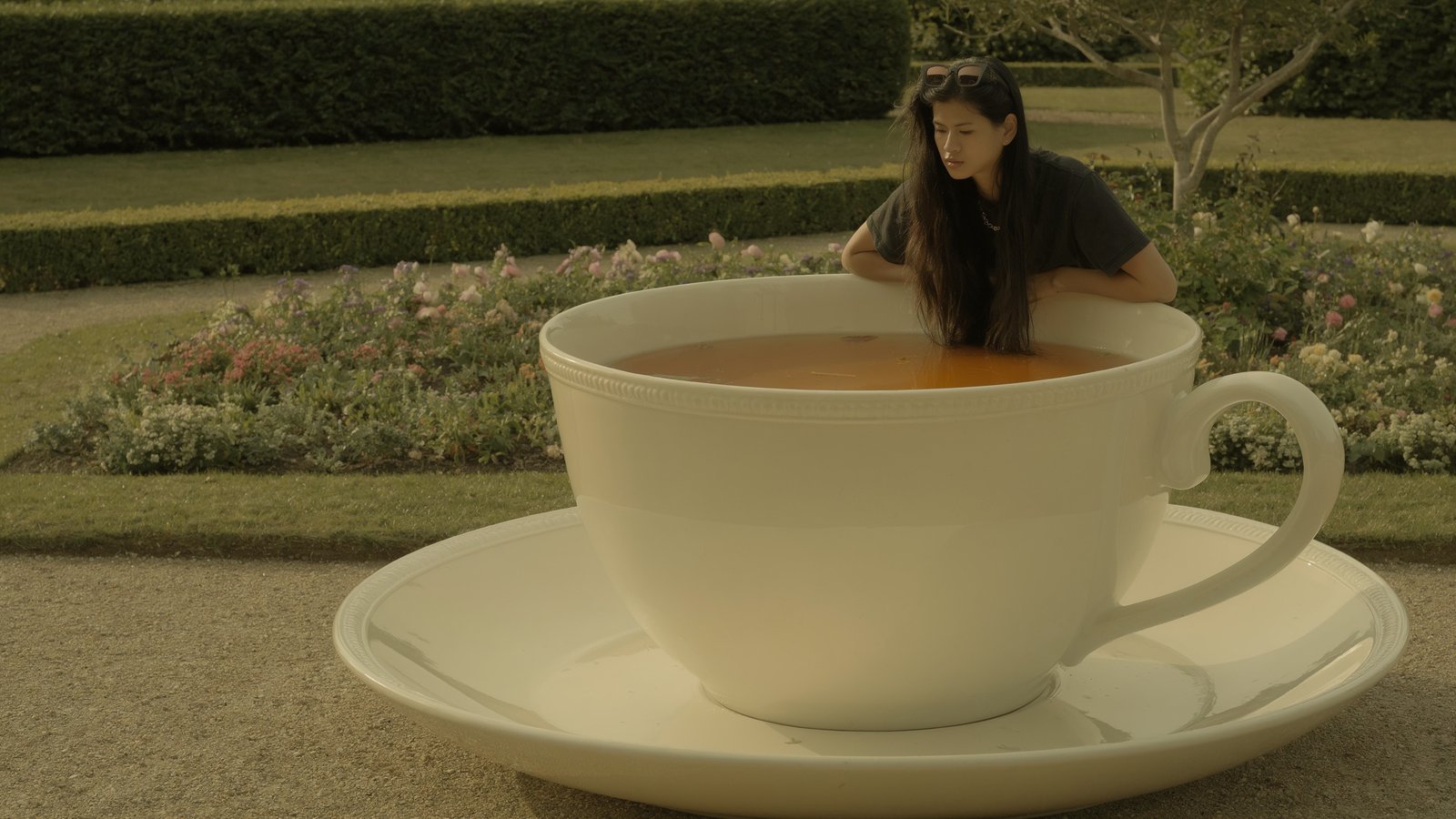 Uni-1 creative composition - woman in giant teacup